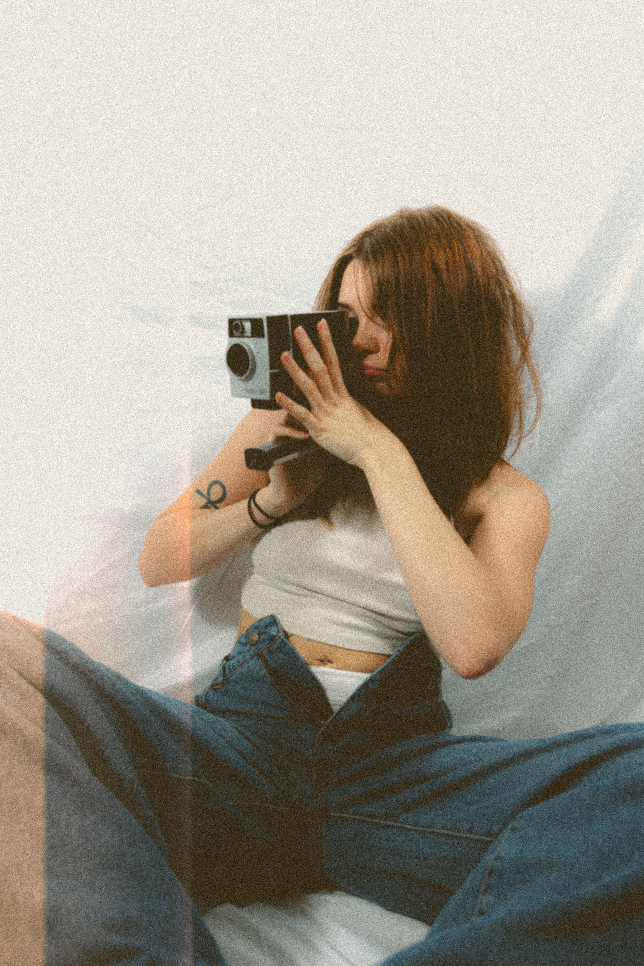 Vintage style photo sequence of someone using an old camera while lying down.