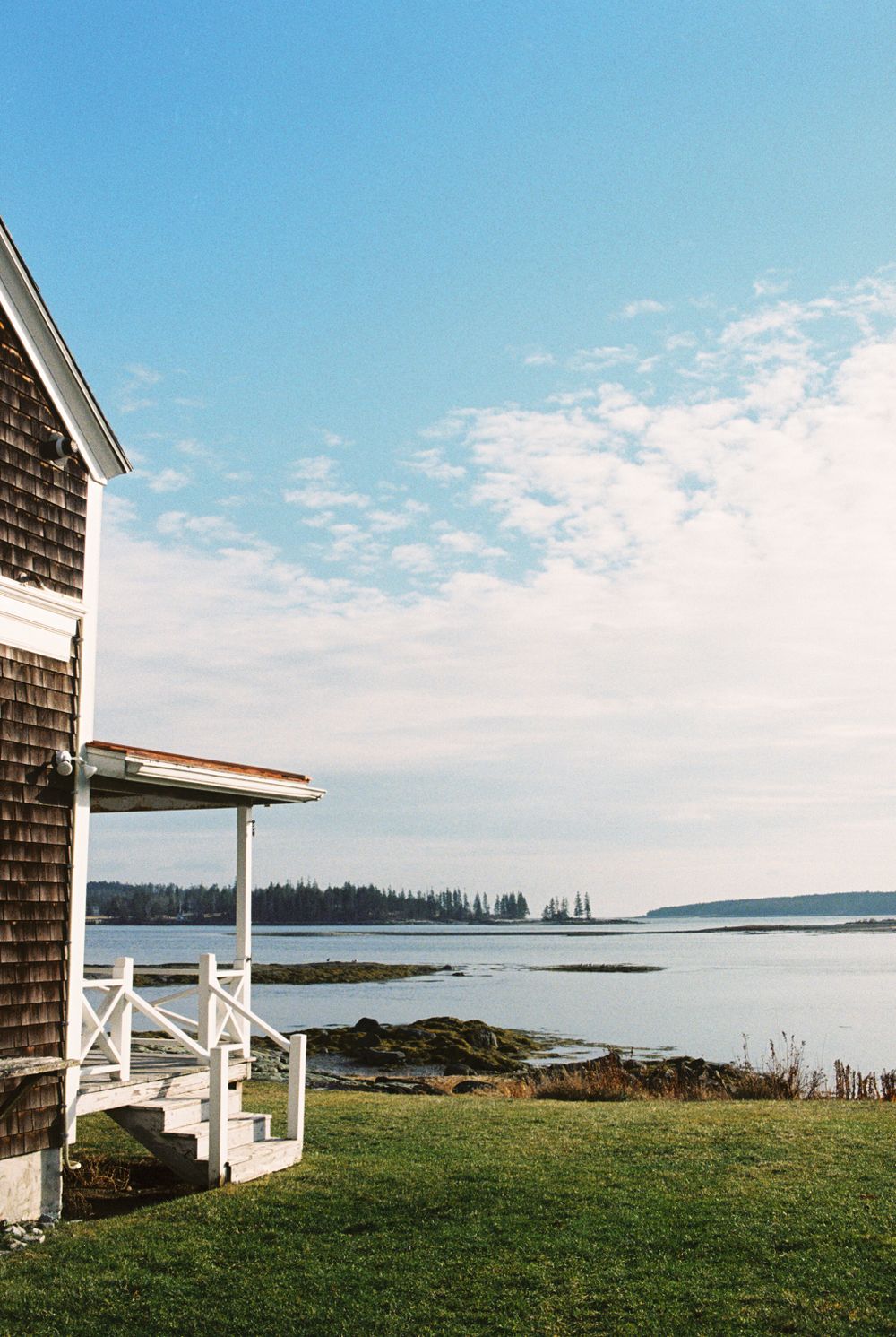 View from the side of the house out to sea at Harbor Cottage in Rockland, Maine.
