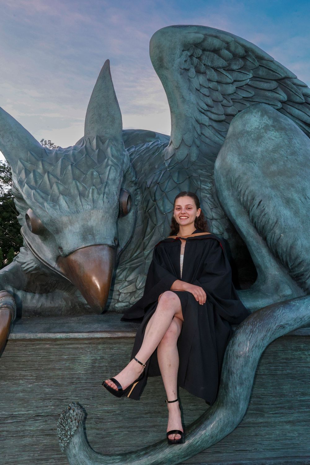 Girl in front of statue