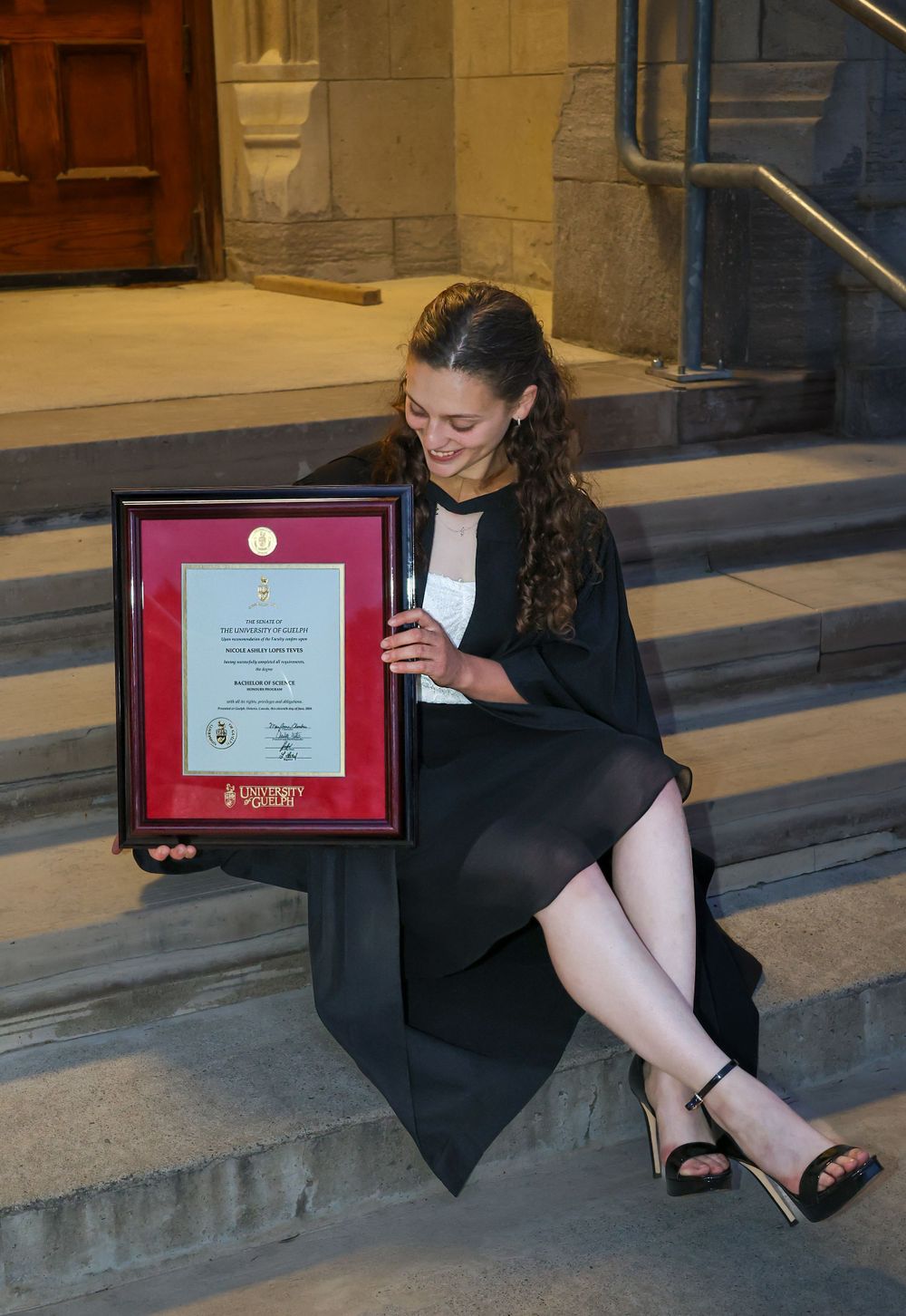 Girl looking at degree