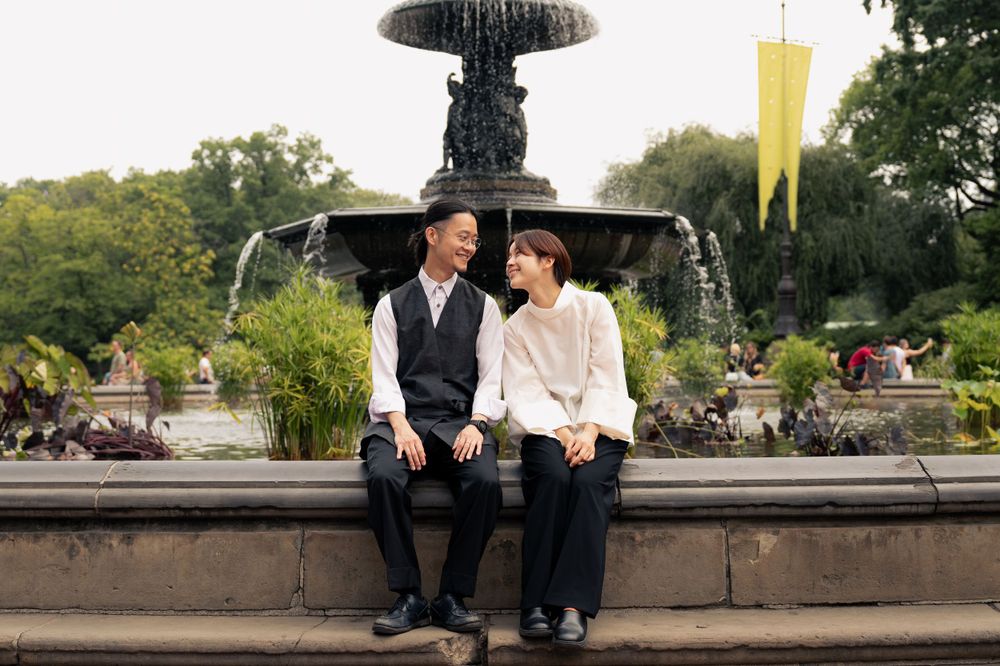 Outdoor couple photography series on stone steps with garden scenery.