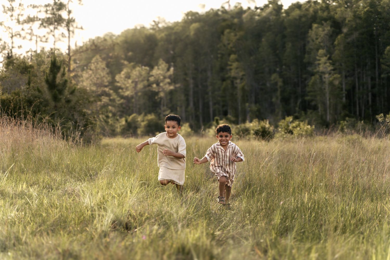 Joyful child running through a sunlit field