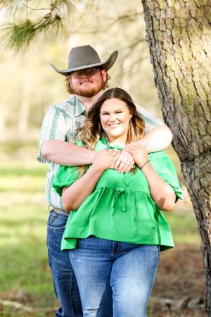 Outdoor engagement photo series in natural lighting with pine trees in background.