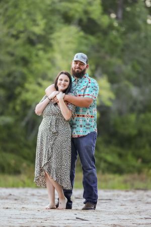 Playful outdoor photo session on a rocky natural surface.