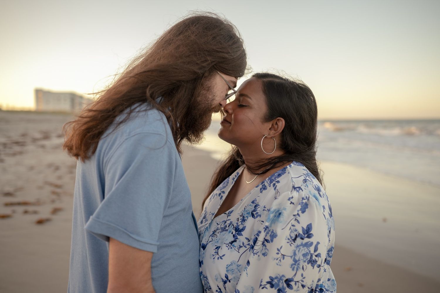 Couple on the beach at sunset romantic engagement session photoshoot Palm Bay Melbourne Cocoa Beach Vero Florida Brevard County
