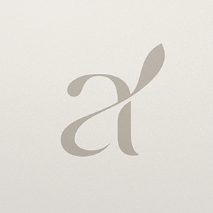Minimalist gray monogram logo design featuring stylized letters on light background.