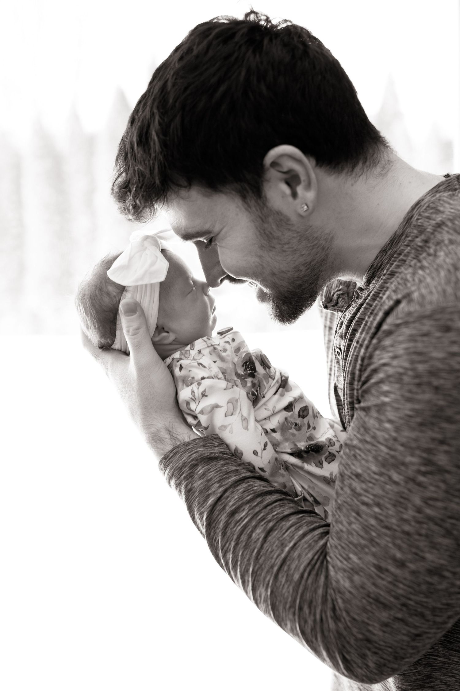 Emotional black and white portrait series showing person wiping tears.
