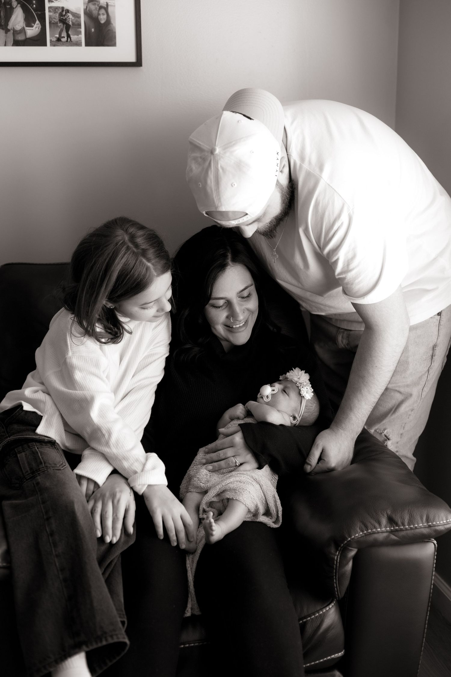 Black and white series of tender family moments on a couch.