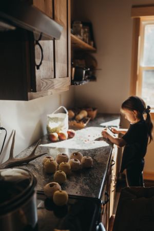 Kitchen scene with fresh ingredients and baking preparation on counter.