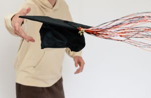Someone wearing a beige sweater demonstrates a wide arm movement sequence against a white background.