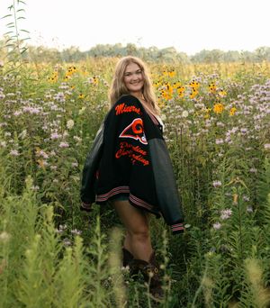 Ali, a Class of 2026 senior from Mineral Ridge High School in Northeast Ohio, poses during her senior portrait session. She is a cheerleader