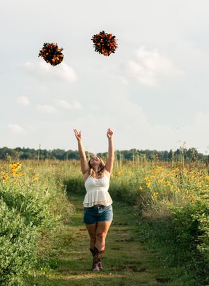 Ali, a Class of 2026 senior from Mineral Ridge High School in Northeast Ohio, poses during her senior portrait session. She is a cheerleader