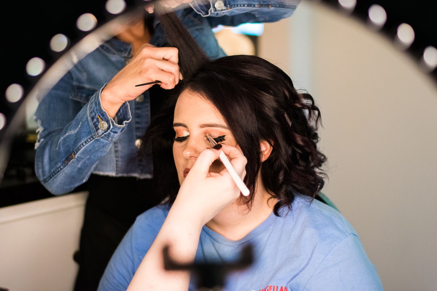 Getting ready for a special occasion with professional hair and makeup preparation.