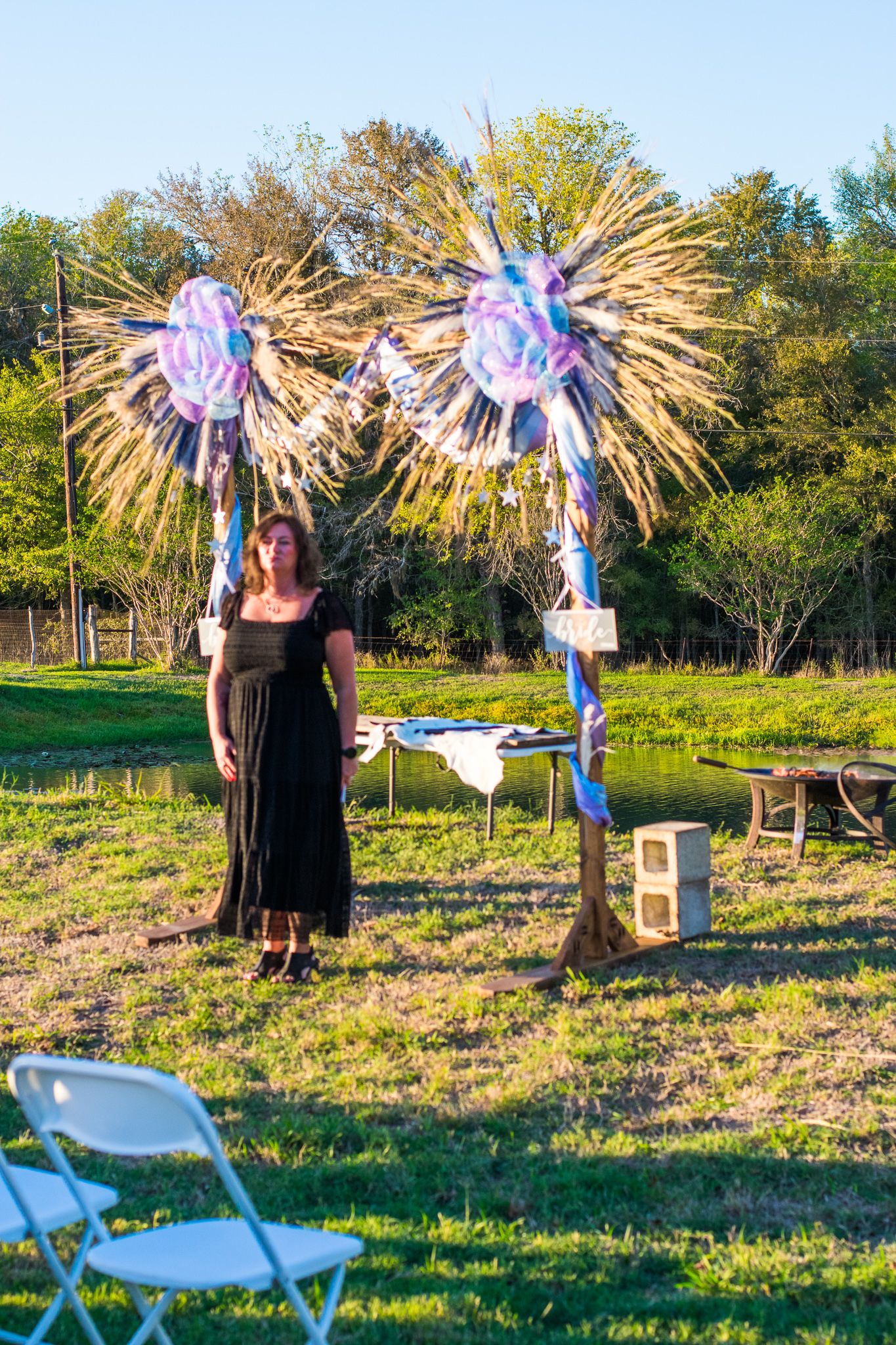 Decorative pink and blue pinwheels displayed at an outdoor gathering.