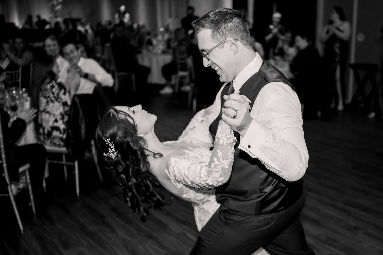 Hotel C by Carmens Wedding Photo in Hamilton, Ontario of a bride and groom dancing on a dance floor.