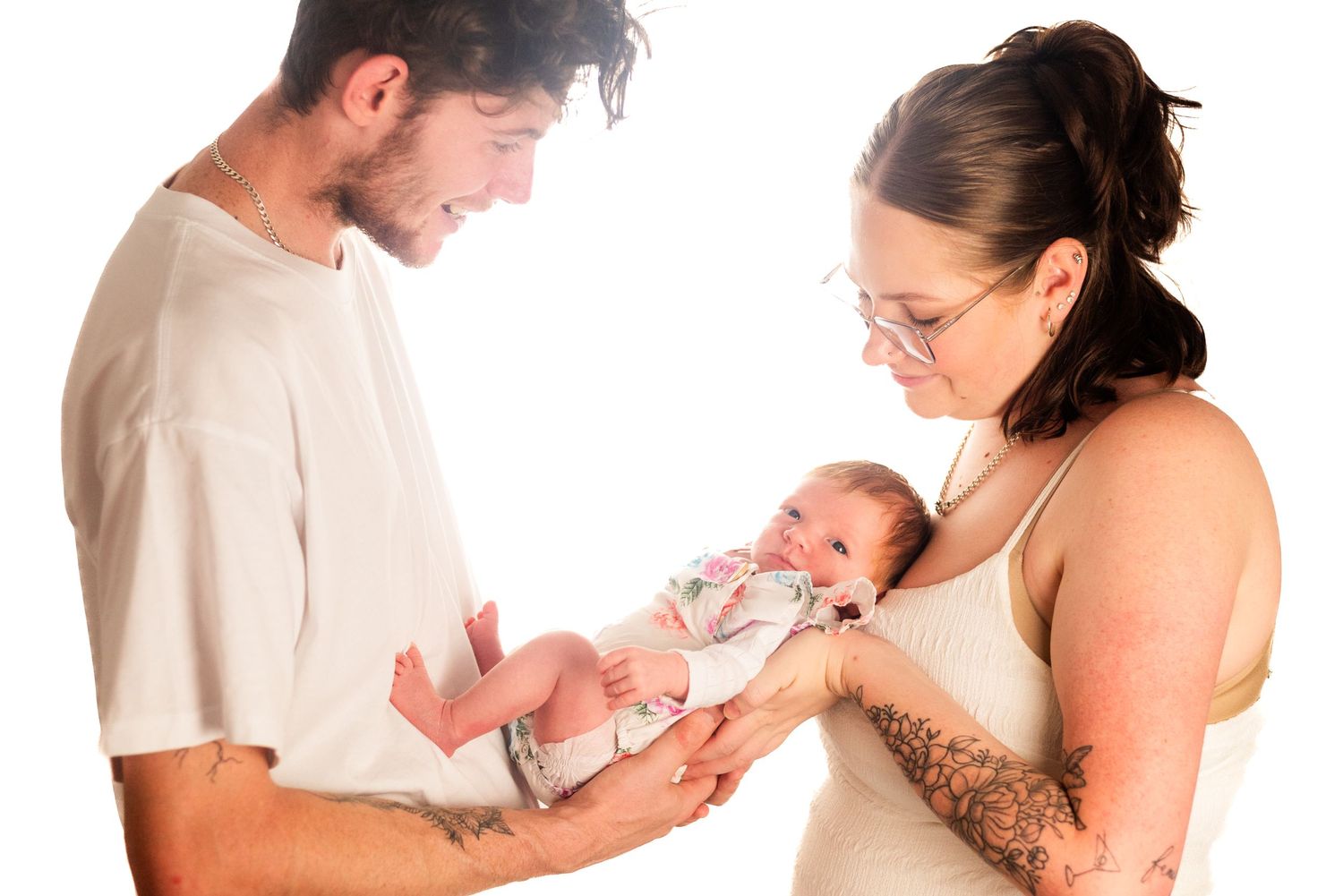 A tender family moment captured against a white background.