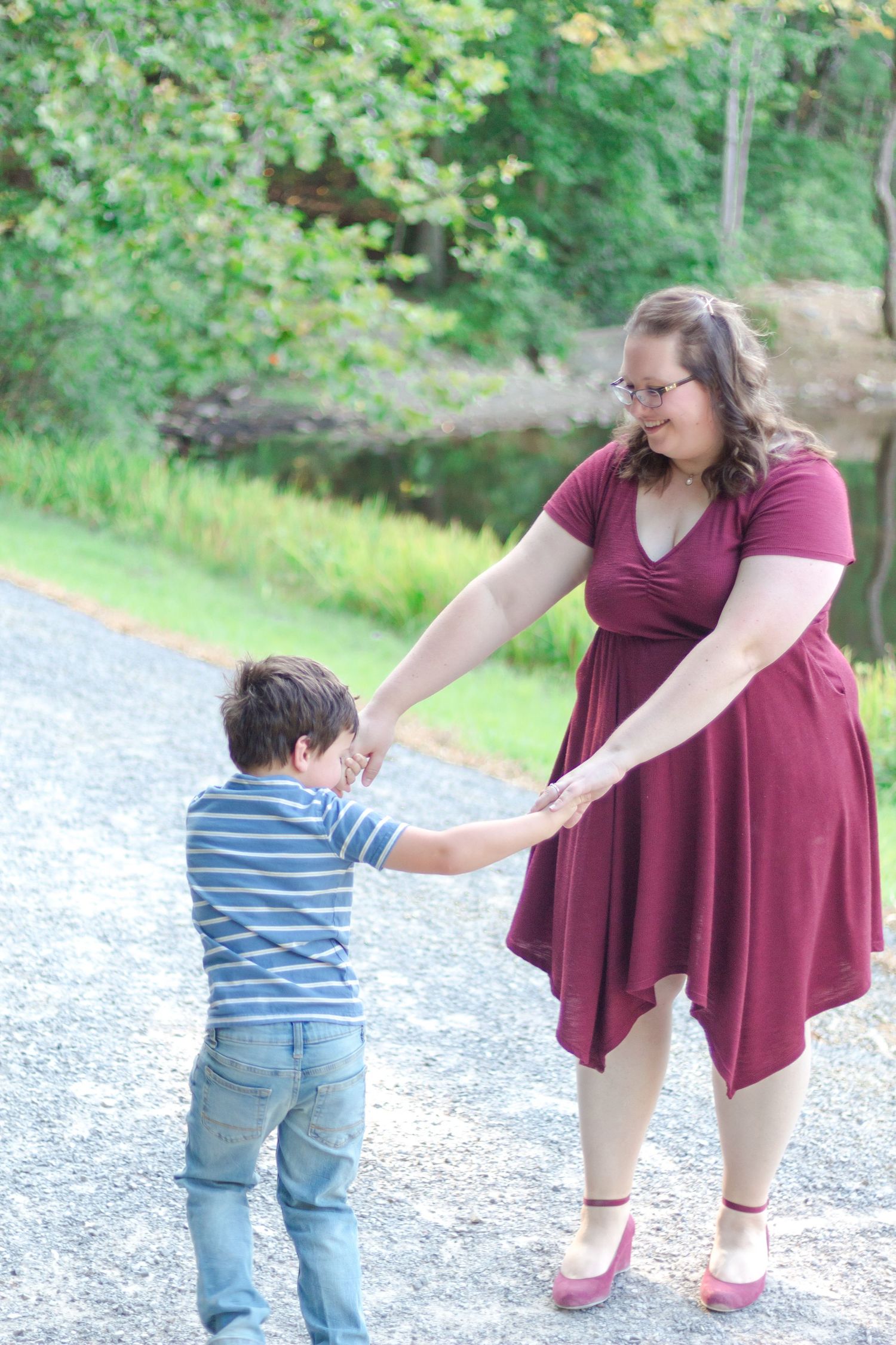 Family Session: Mother and son playing ring around the rosie at Madison County Nature Preserve
