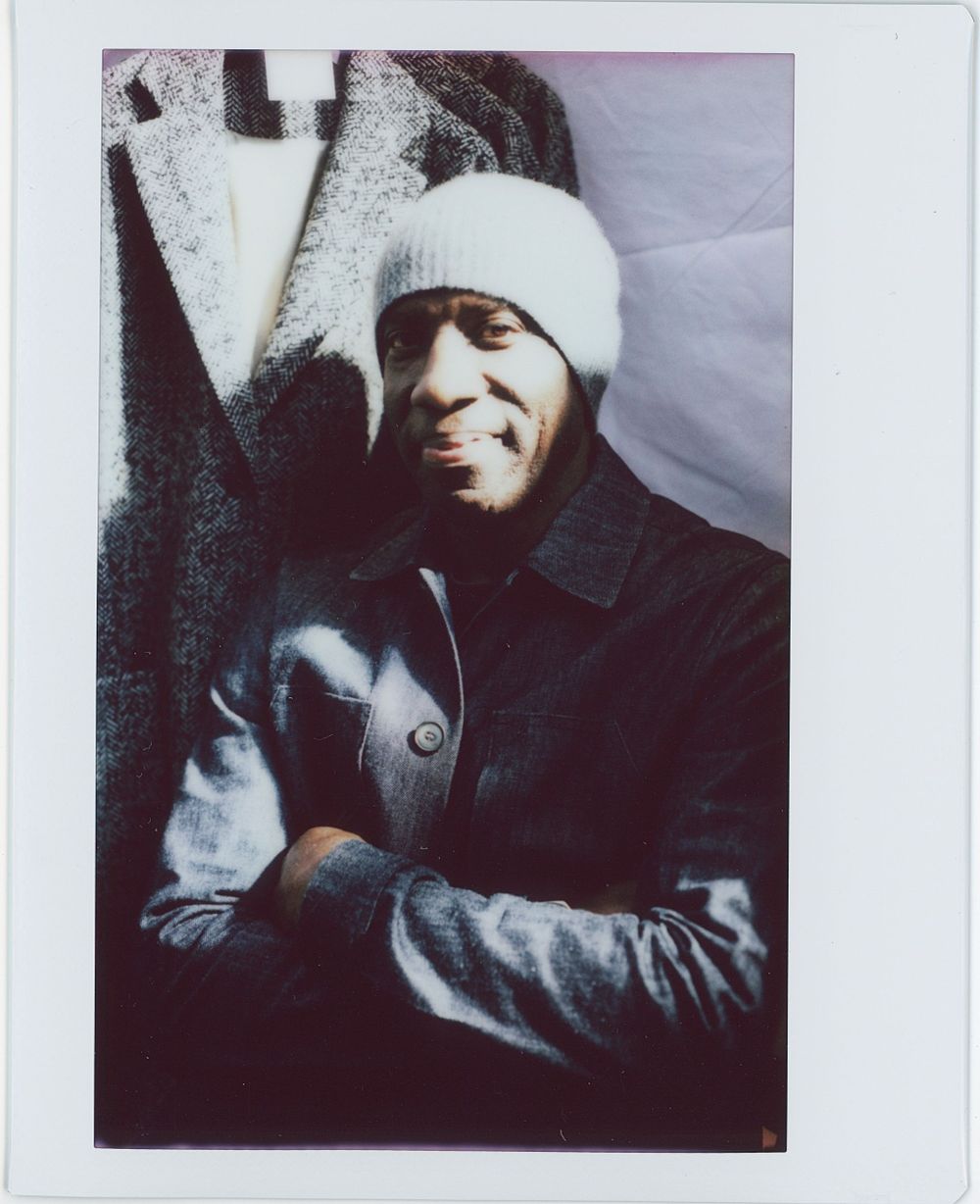 photo of a fashion designer, Marvin Browne, at his shop in London. Taken on a vintage Polaroid camera with Instax Wide Film.