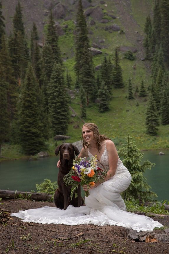 romantic couple in a field of wildflowers in colorado