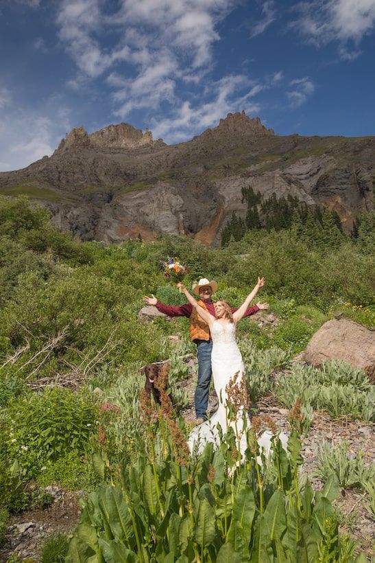 romantic couple in a field of wildflowers in colorado
