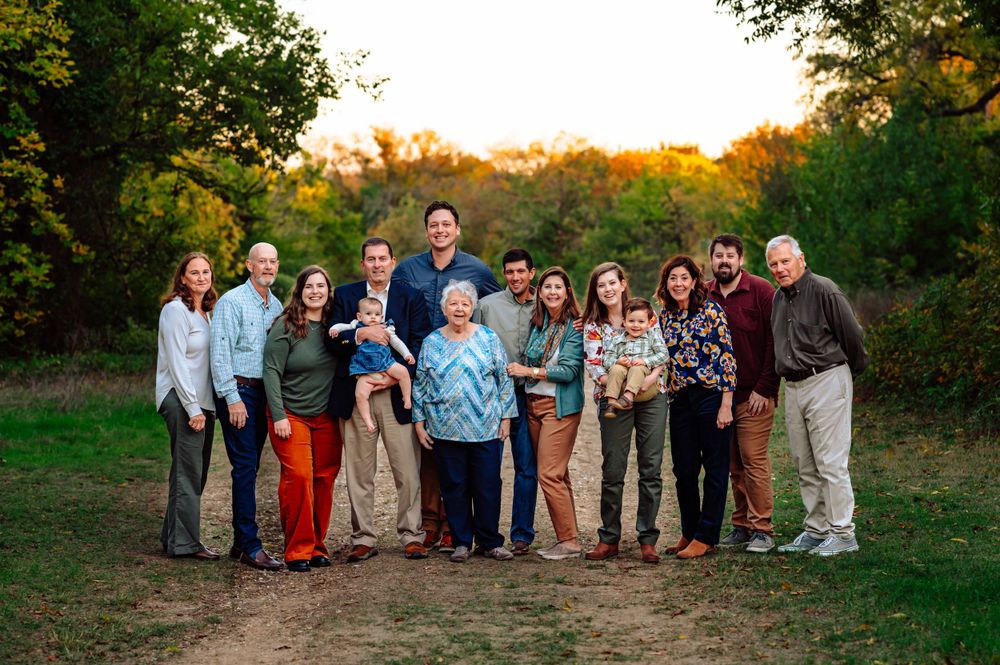 Great grandma and extended family of 14 pose together for dallas area sunset outdoor extended fall family photo session