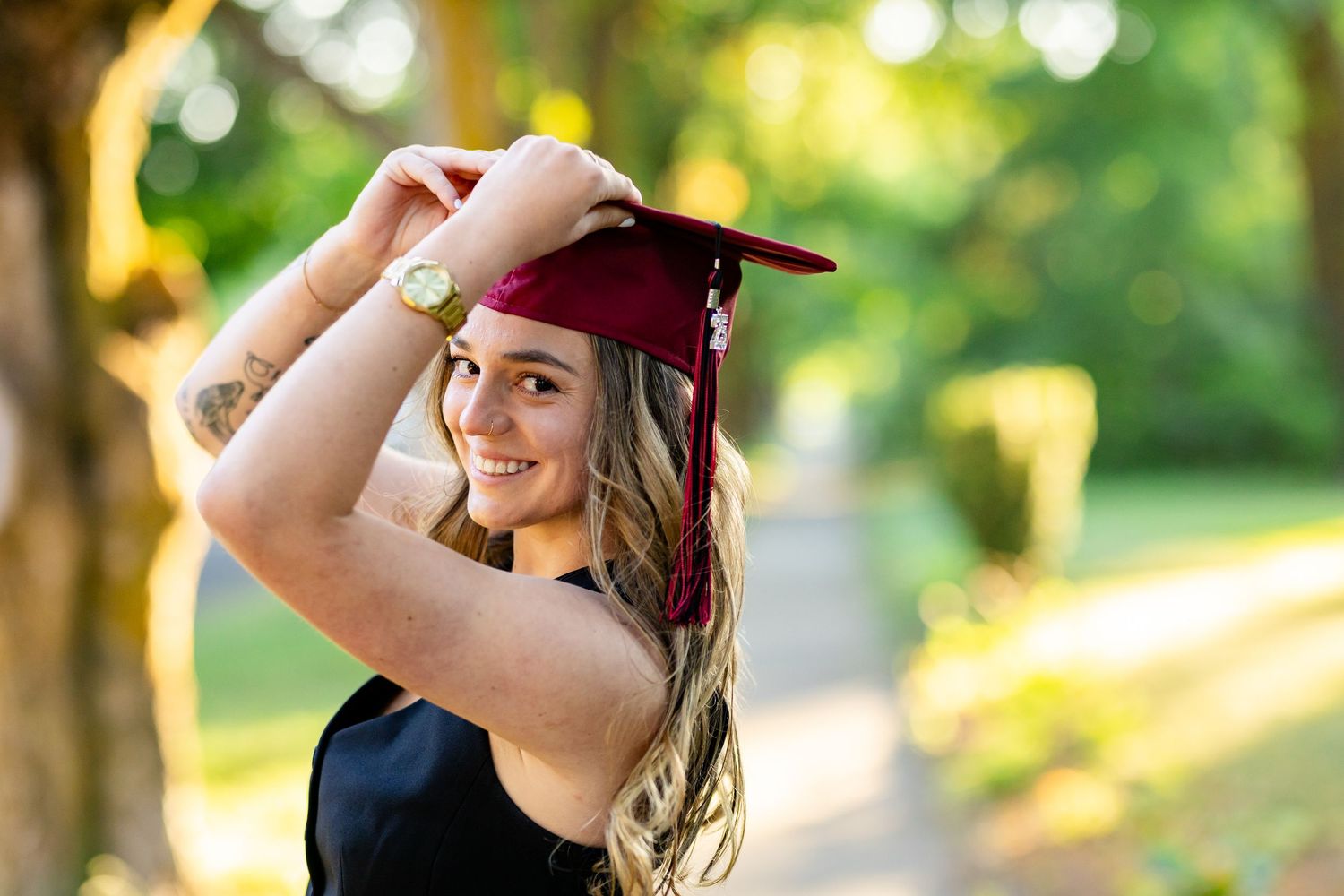 Central Washington University graduate poses at the university in Ellensburg, WA for her senior graduation photography session.