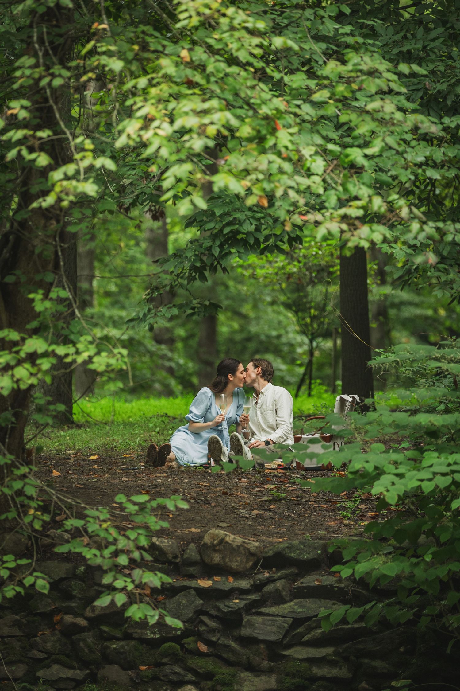 Couple embraces by a misty pond at the rock creek park