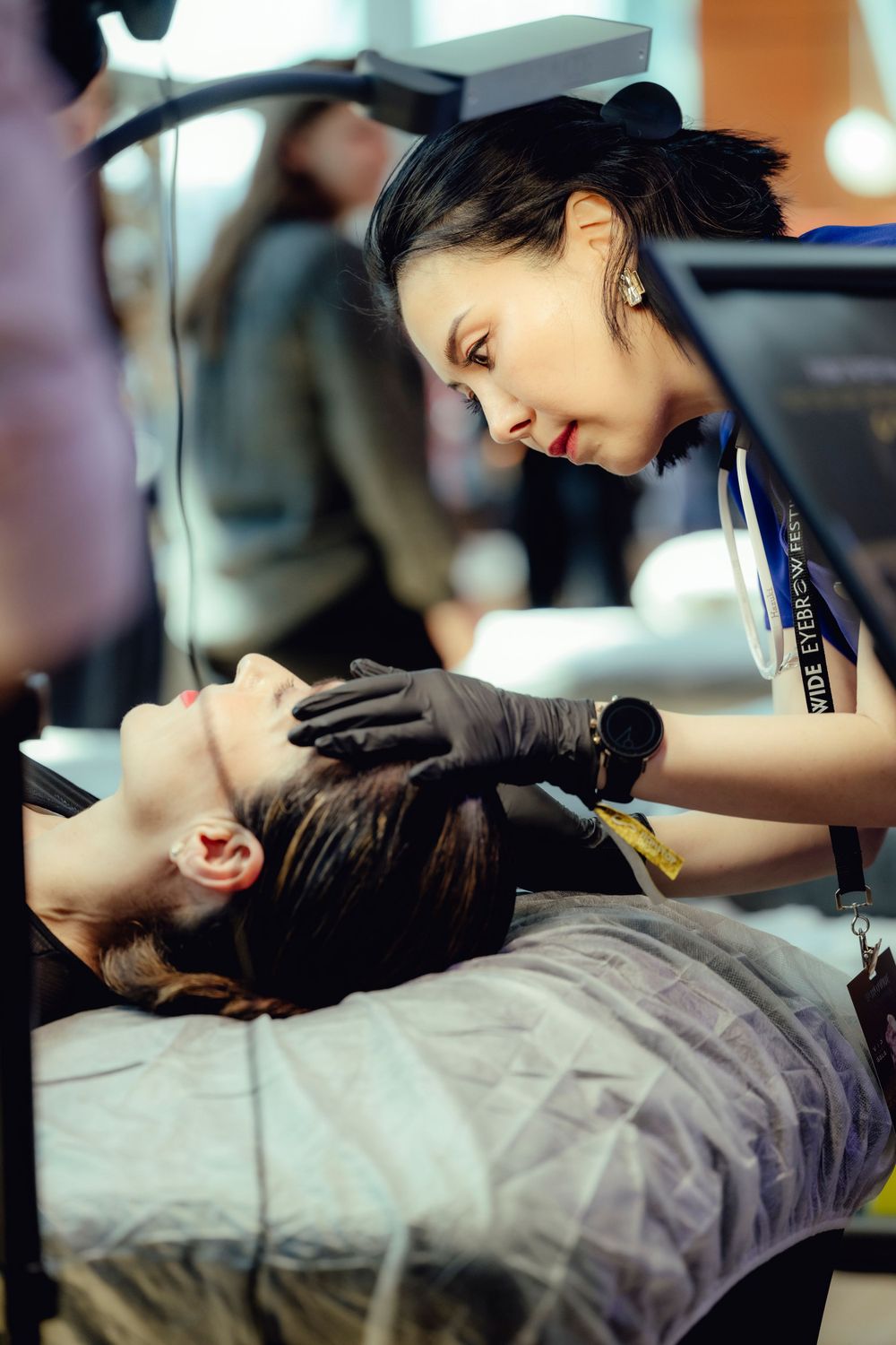 A cosmetologist provides a professional facial treatment to a client in a spa setting.