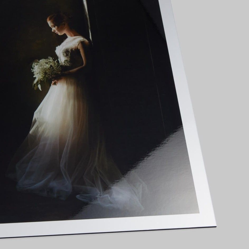 Stunning wedding photograph of a bride printed on glossy photo paper with a reflective surface