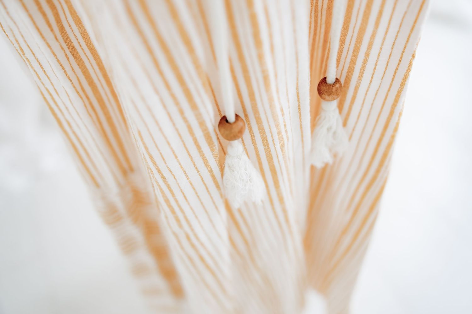 Abstract macro shot of tan striped fabric texture pattern.