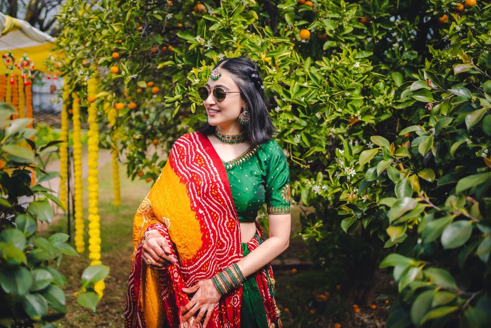 Traditional Indian pre-wedding celebration with bright marigold decorations and colorful attire.
