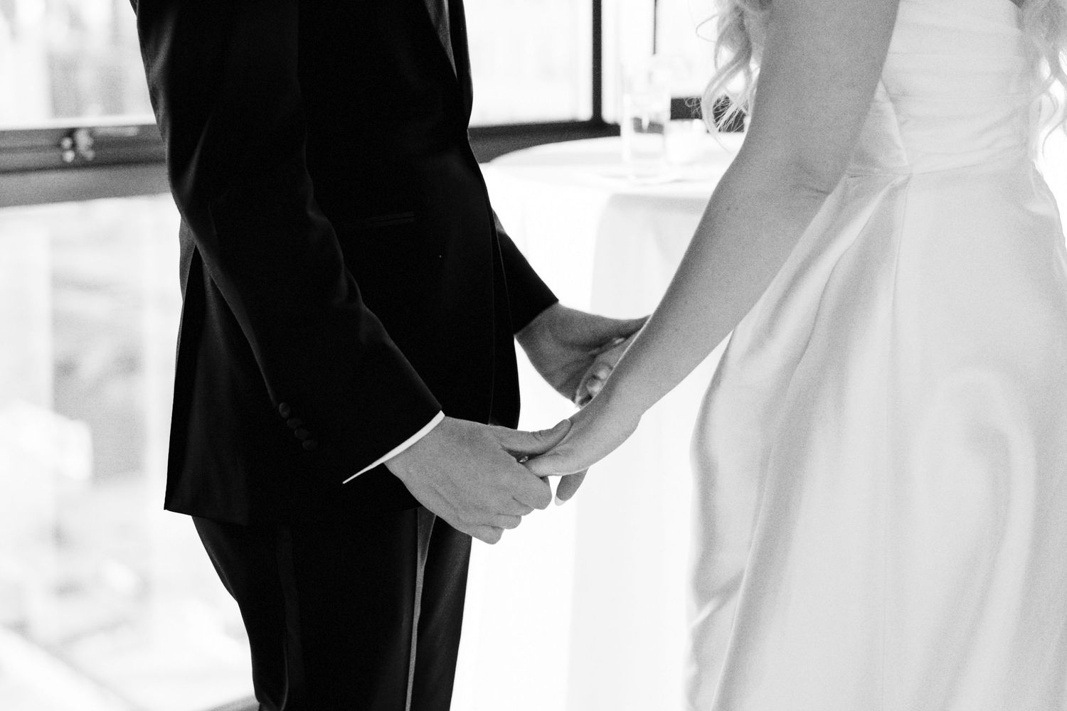 Newlyweds hold hands after ceremony in Wythe Hotel, Williamsburg, Brooklyn; editorial film wedding photographer