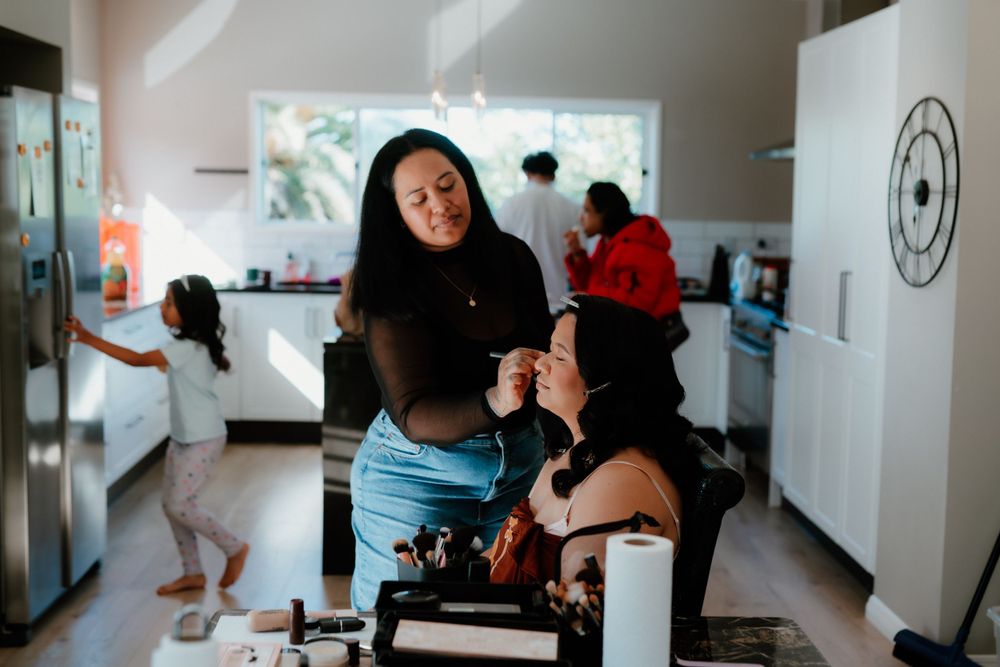Wedding morning preparation scene in a bright, modern kitchen setting.