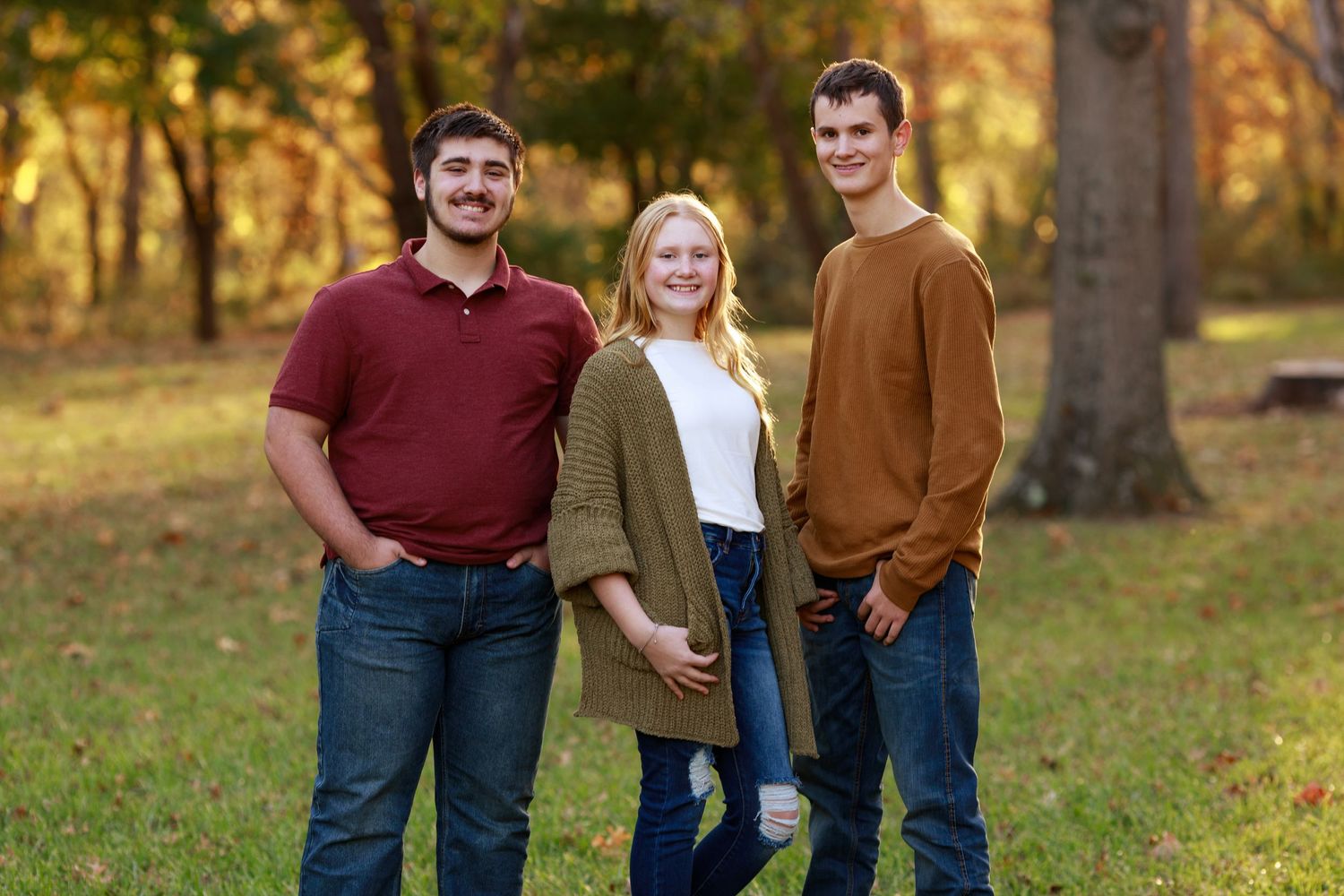 Siblings strike a pose during their family pictures at Lake Charleston.