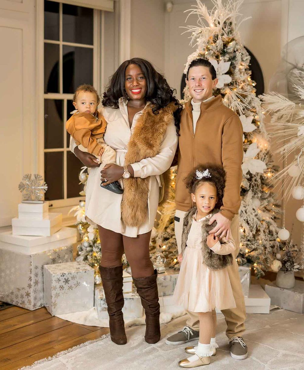 festive family portrait by Christmas tree, Toronto home