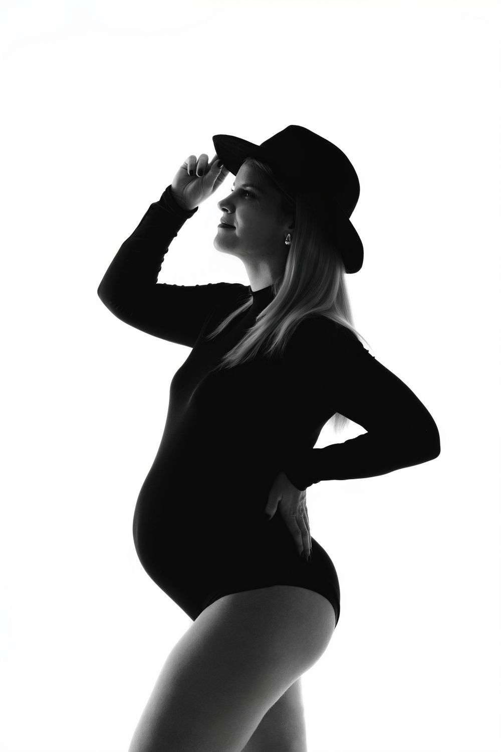 Dramatic silhouette poses in black and white photography series.