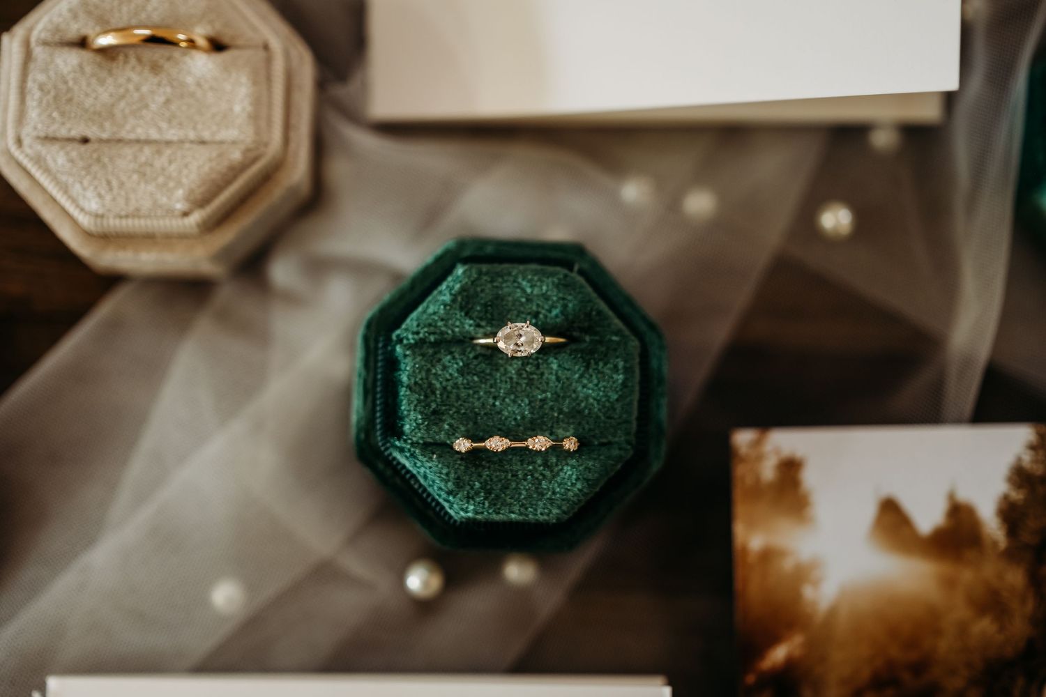 Detail shot of wedding ring in green ring box for wedding in Fayetteville, Arkansas.