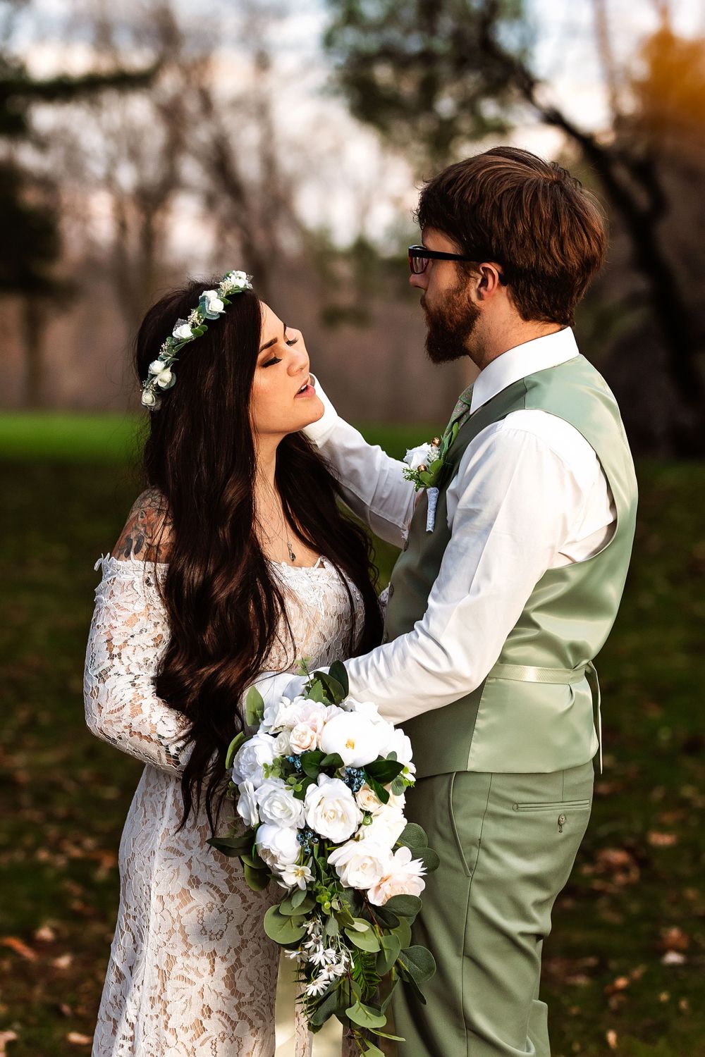 Newlyweds share intimate moment in garden setting with white floral bouquet.
Janesville, WI
Brodhead, WI