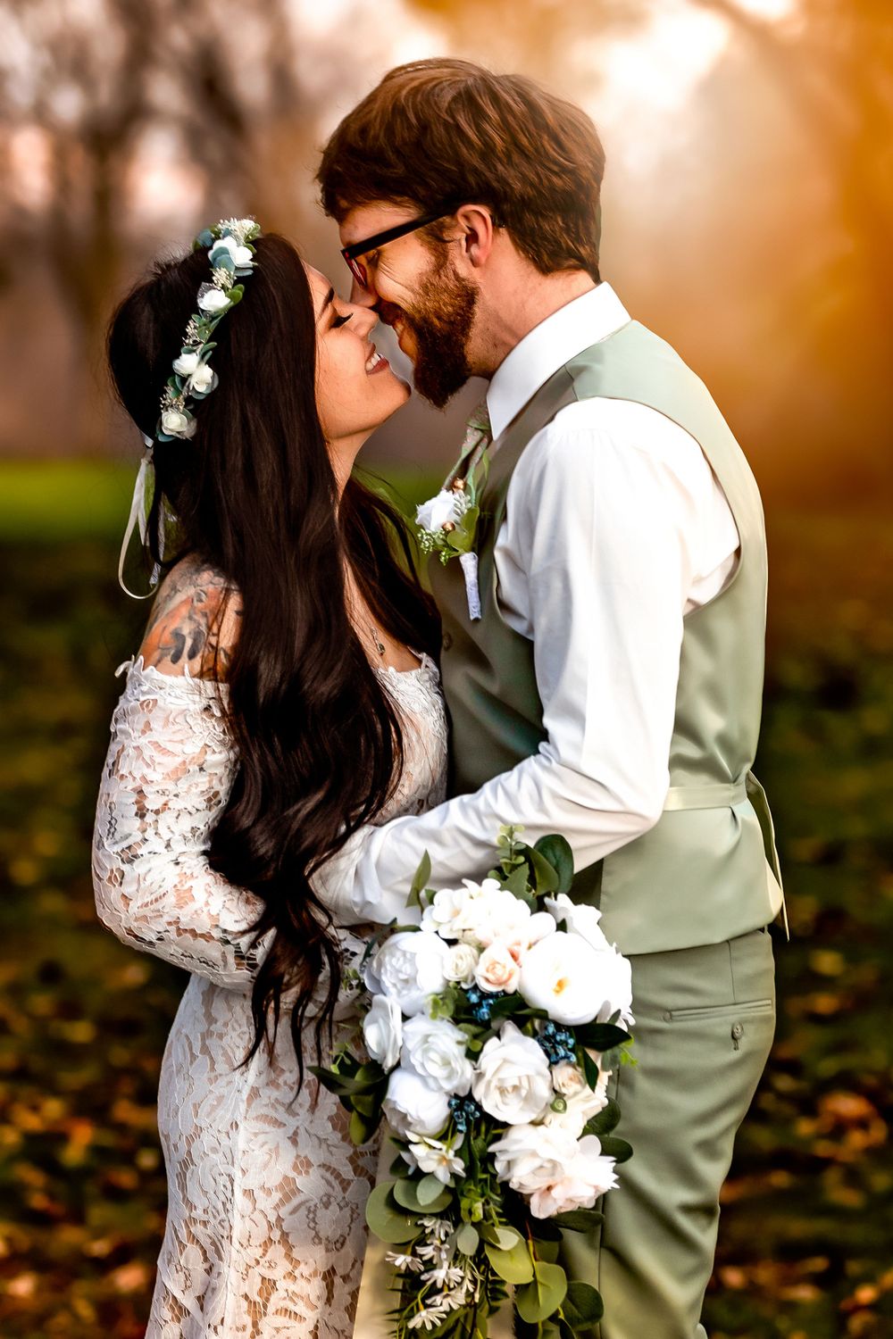 Romantic autumn wedding photo with couple embracing among fallen leaves.
Janesville, WI
Brodhead, WI
