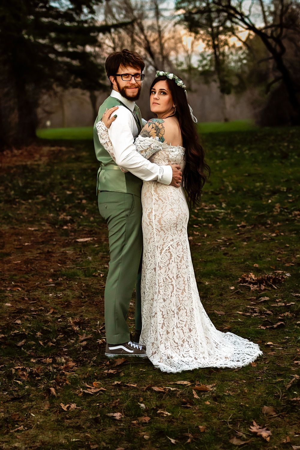 Wedding portrait of couple in sage green and lace white attire against autumn backdrop.
Janesville, WI
Brodhead, WI