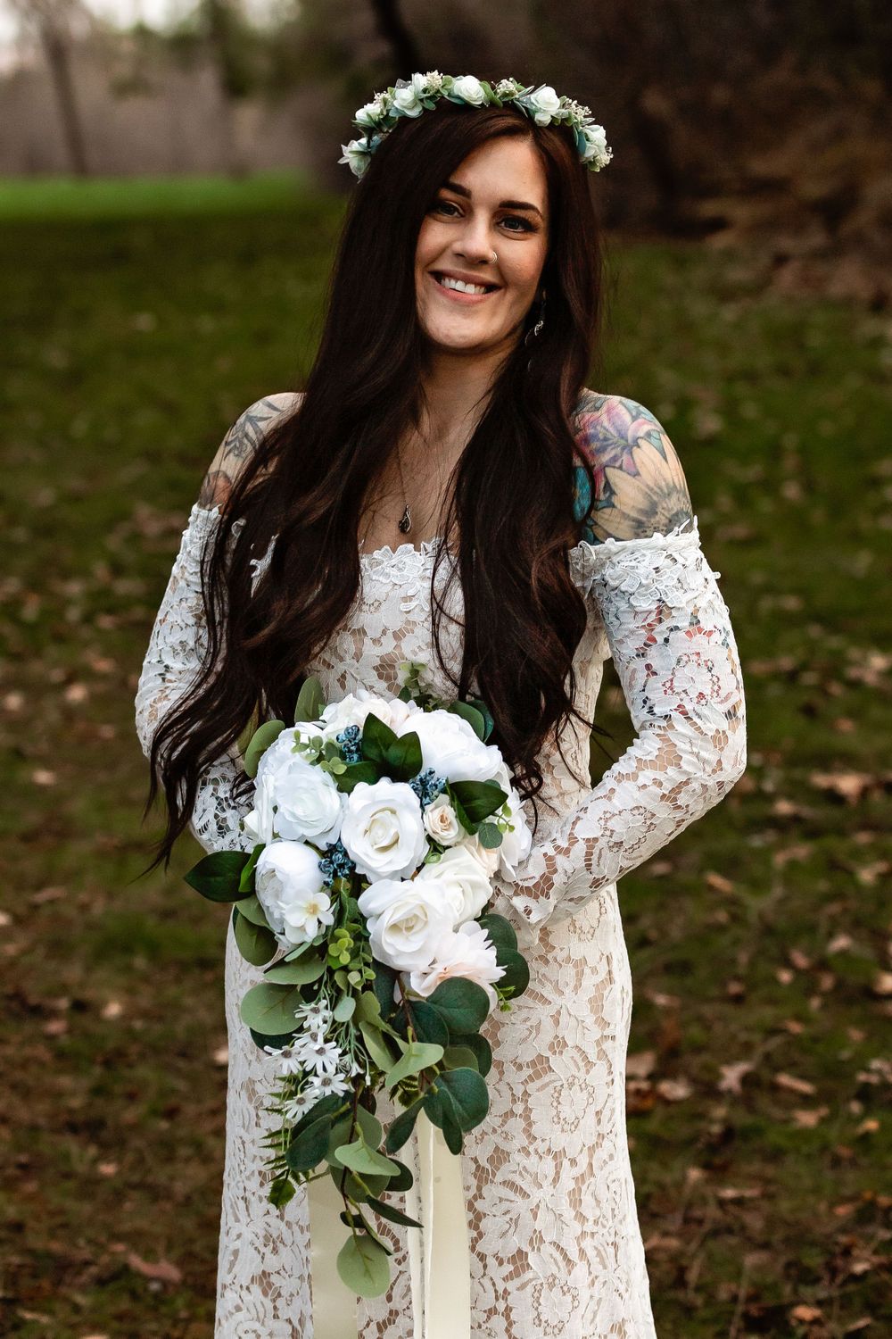 Bride in lace gown and flower crown holding classic white and green bouquet.
Janesville, WI
Brodhead, WI
