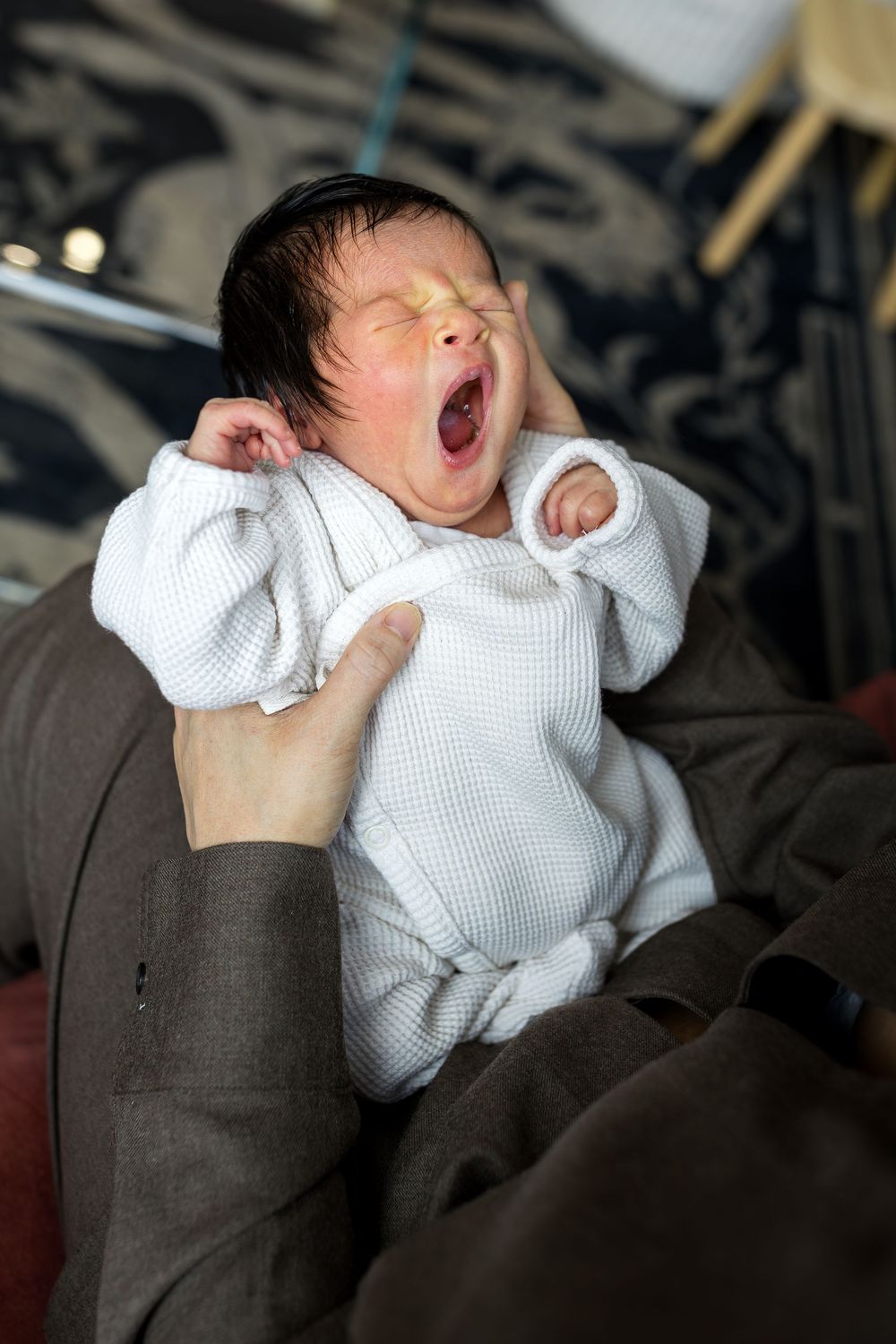 newborn baby girl yawning