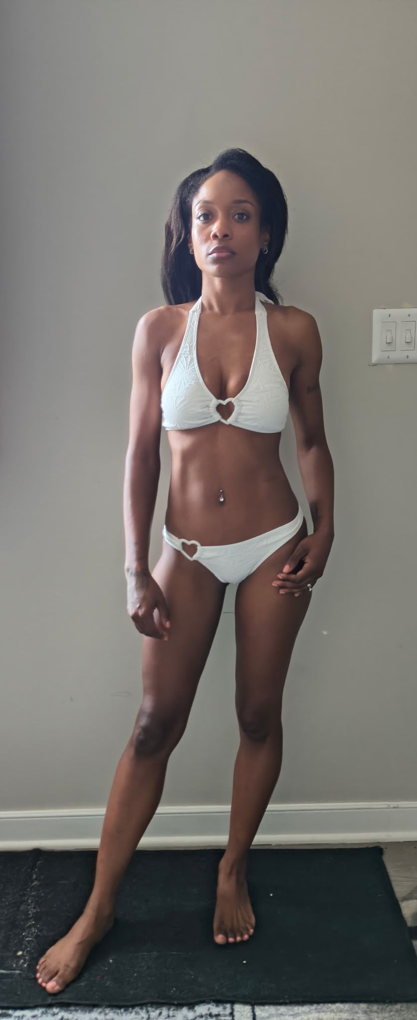 Front swimsuit digital of Genesis Dudley wearing a white bikini.
