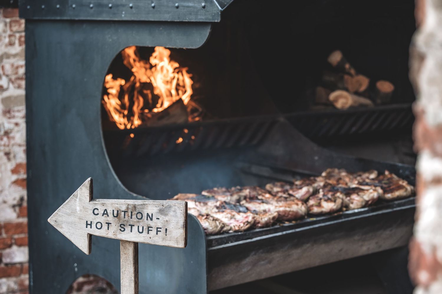 Food cooking over an open fire at Hazel Gap Barn