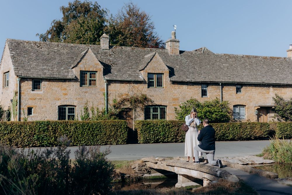 Surprise proposal on the bridge in Lower Slaughter, Cotswolds.