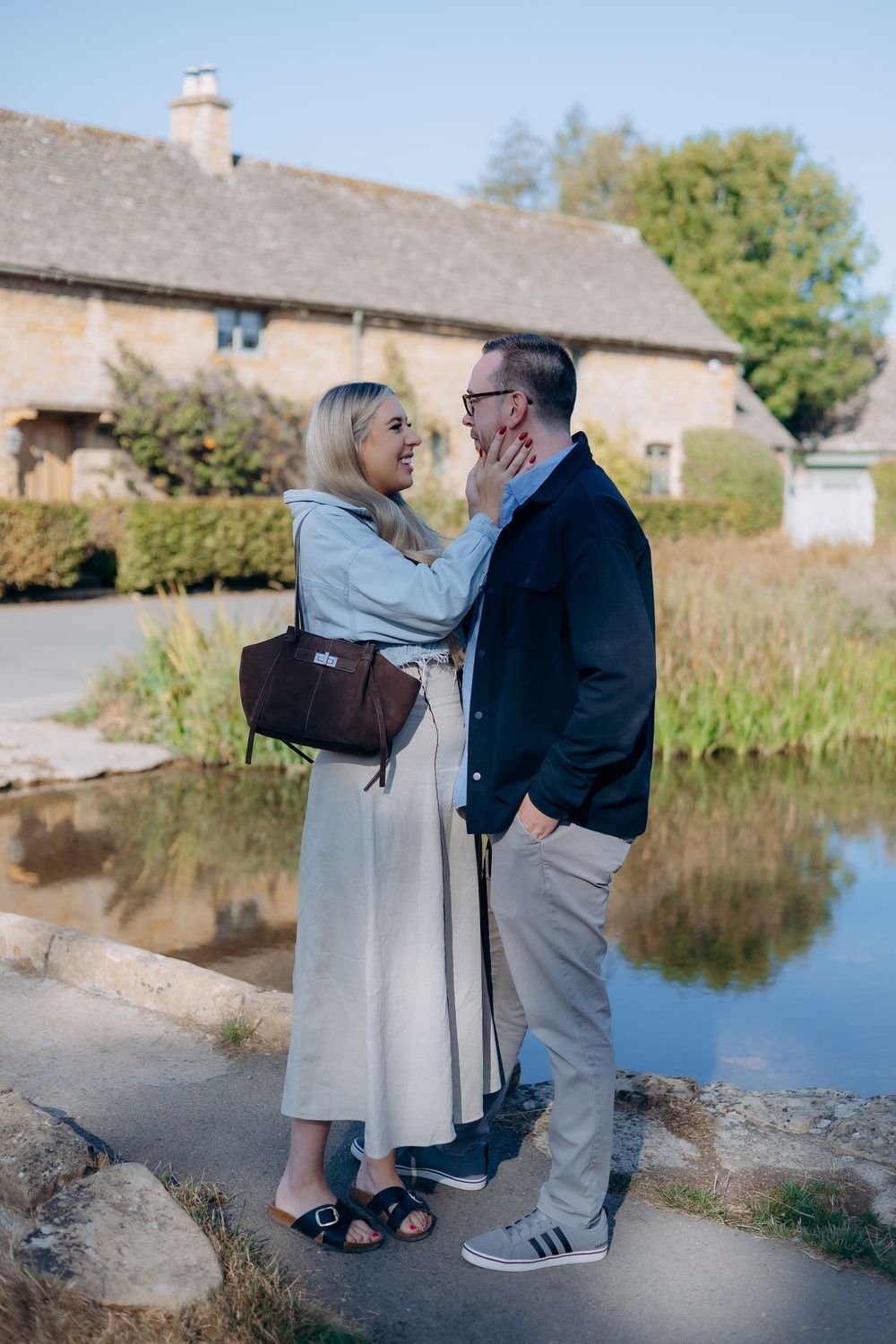 Emotional surprise proposal in Lower Slaughter village.