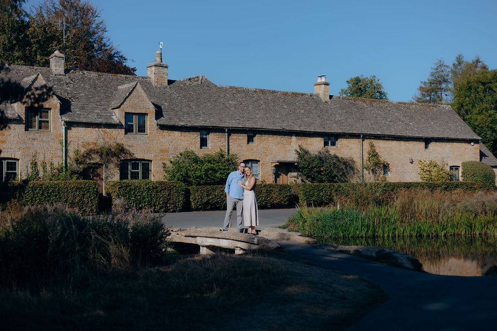 Couple celebrating after a Cotswolds proposal.