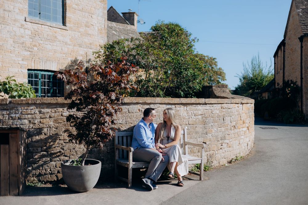 Romantic proposal on the bridge in Lower Slaughter, Cotswolds.
