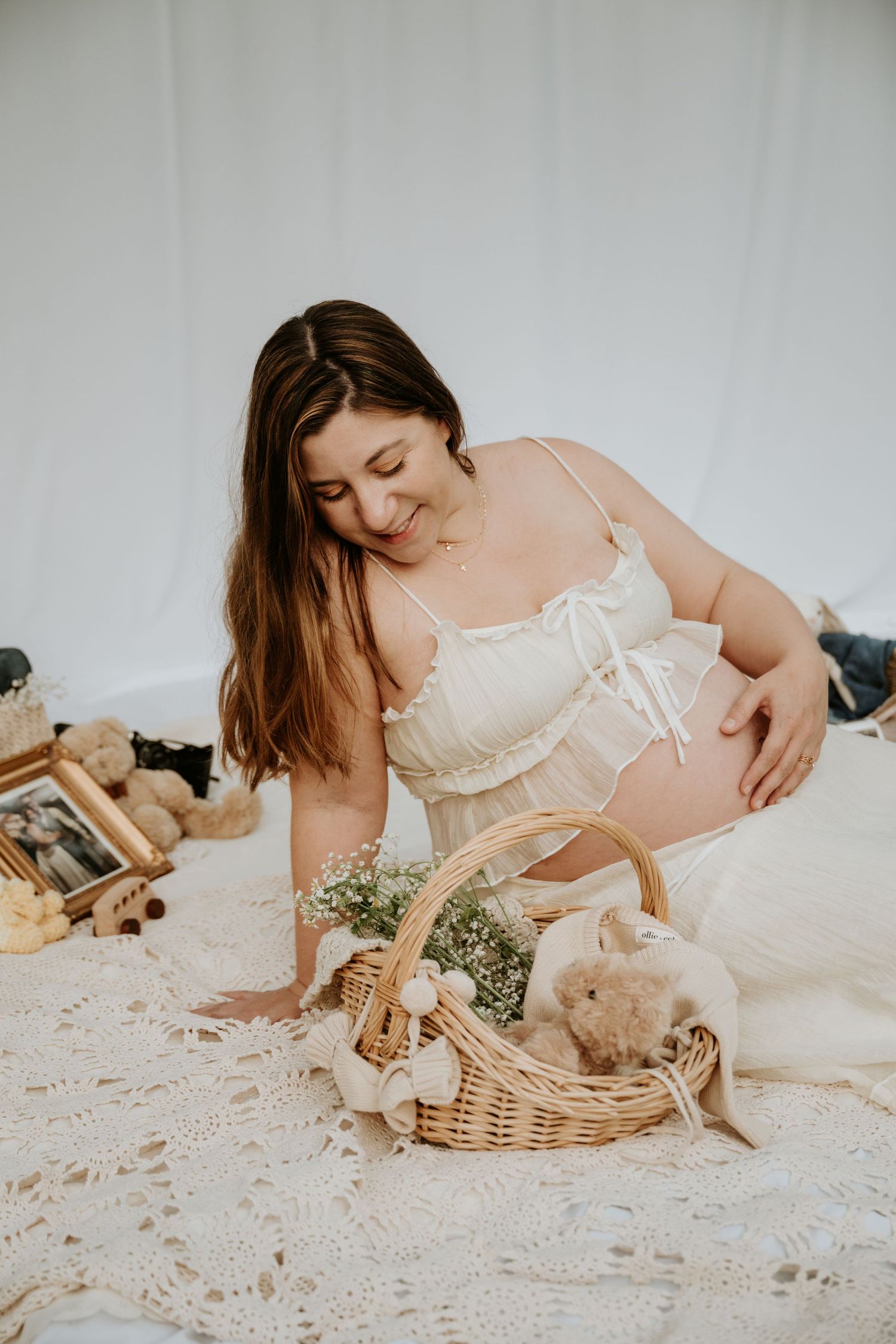 Outdoor session with basket full of flowers during maternity session in Warren NJ