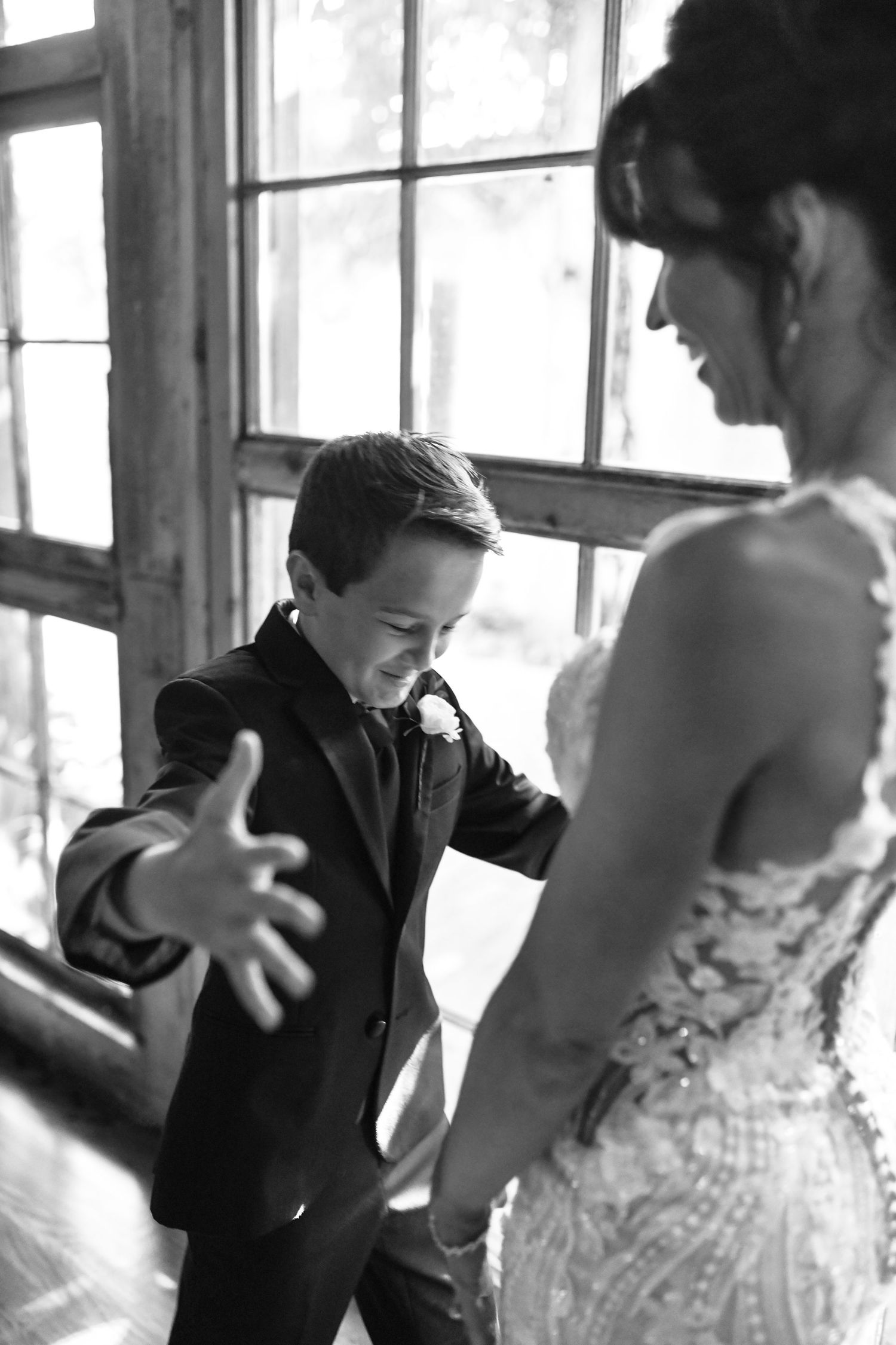 Megan hugging her son during their wedding day first look